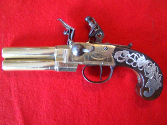 A fine late 18th century English tap action over/under brass barreled flintlock pistol — image 4